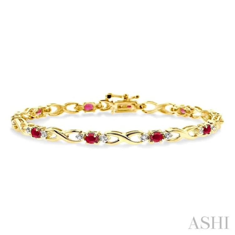 4x3mm Oval Cut Ruby and 1/10 Ctw Single Cut Diamond Bracelet in 10K Yellow Gold