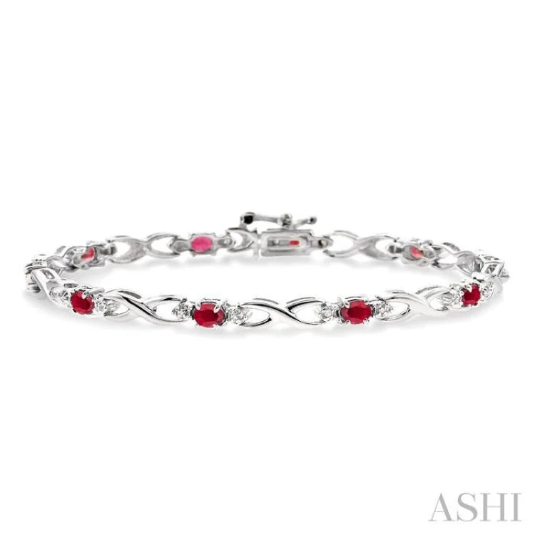 4x3 MM Oval Cut Ruby and 1/10 Ctw Single Cut Diamond Bracelet in 10K White Gold